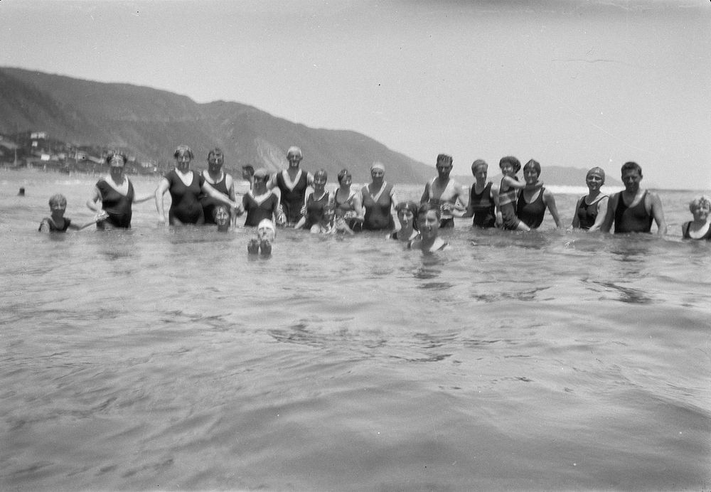 Group in water at Paekākāriki Beach (1920s to 1930s) by Roland Searle.