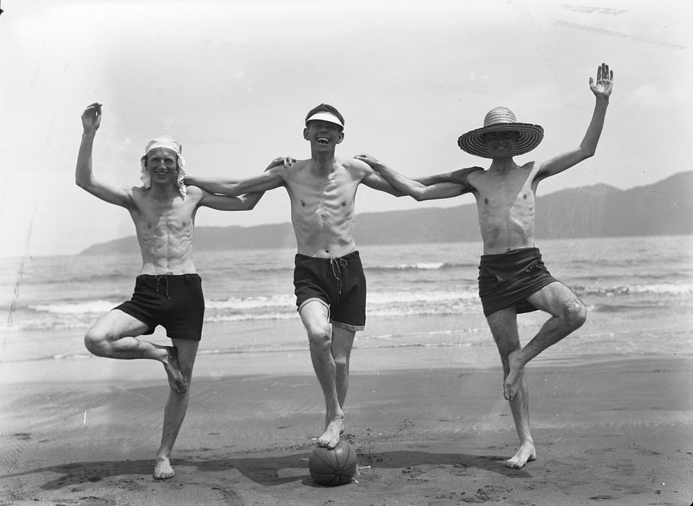 Three men at the beach, Paraparaumu (1920s to 1930s) by Roland Searle.