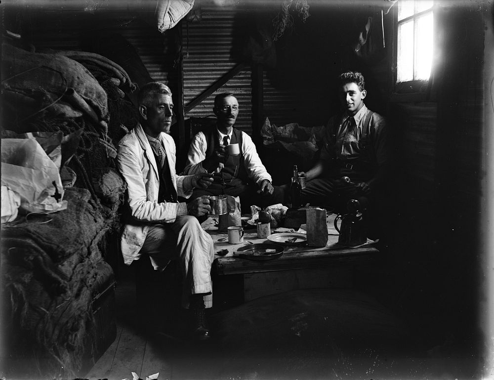 We dine in the fishermen's hut at Waikanae Beach (23 February 1921) by Leslie Adkin.