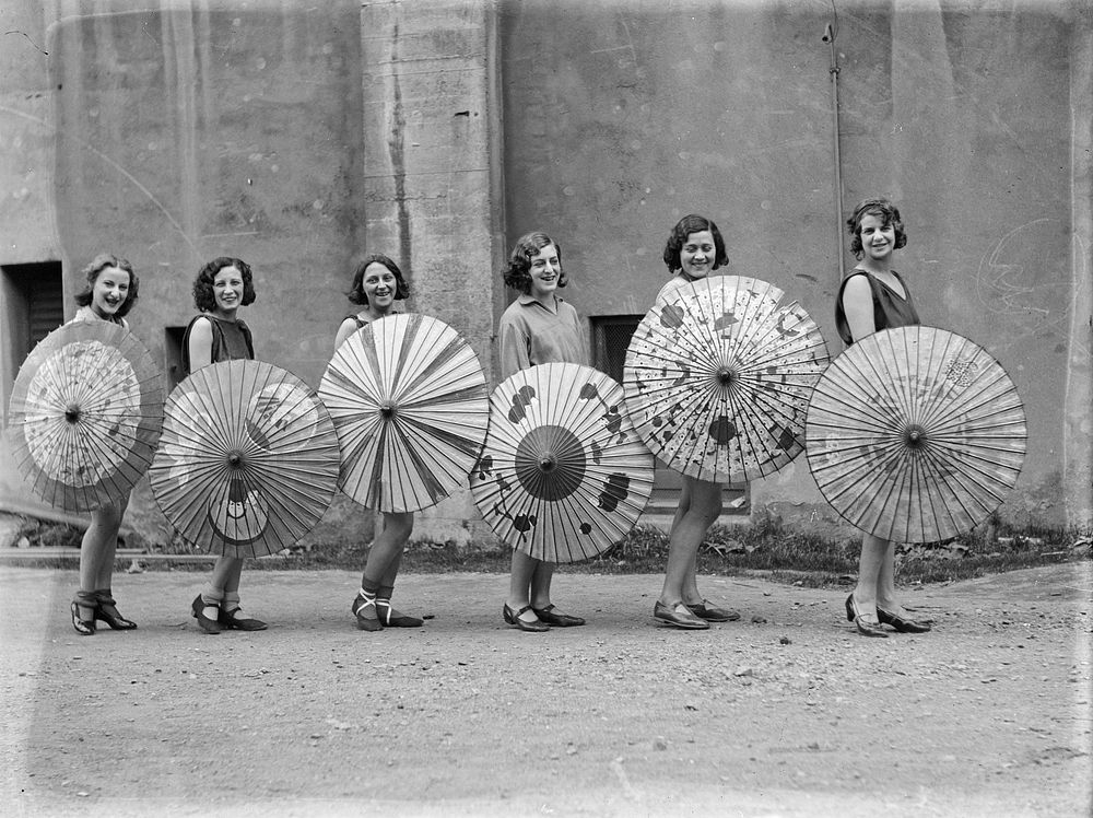 Six women with parasols by Leslie Adkin.