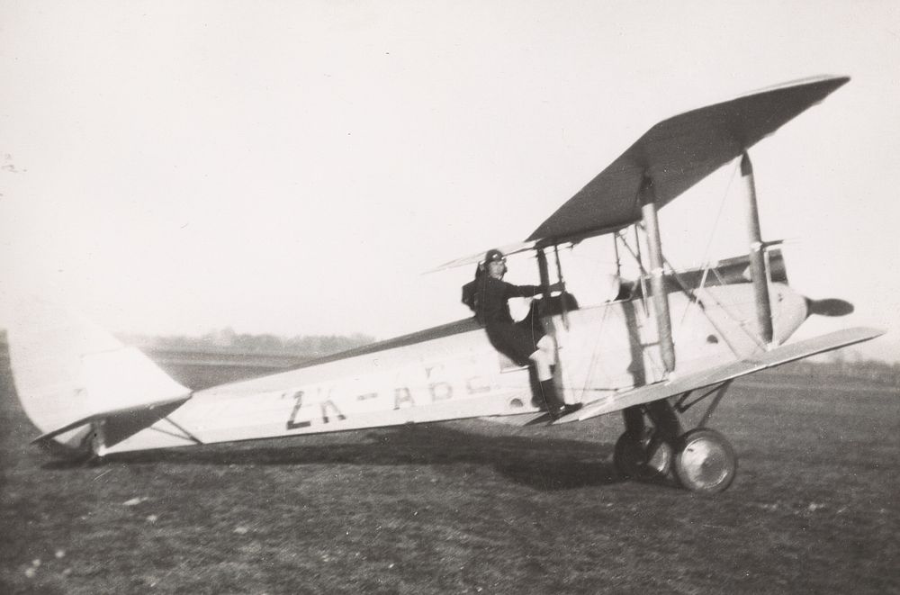 James Frederick Cane by a biplane.  From the album: James Cane photograph album (1929).