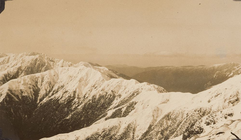 Snow on mountain ranges. From the album: Tararua tramping [circa 1920s] (1920s) by Leslie Adkin.