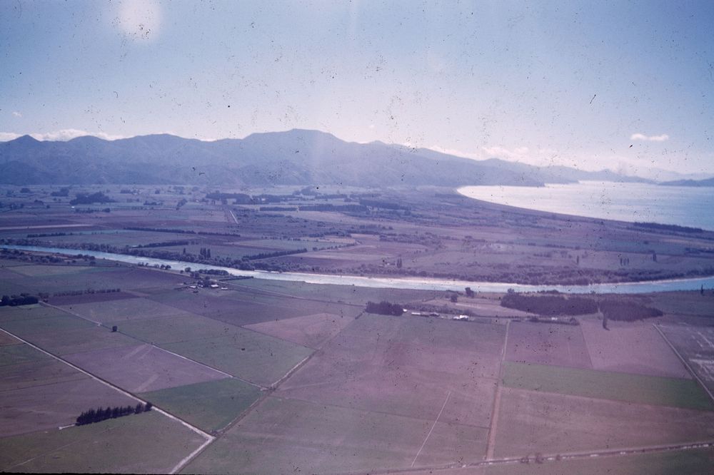 Lower Wairau Plain with lower course of Wairau River and Port Underwood (24 March 1959) by Leslie Adkin.