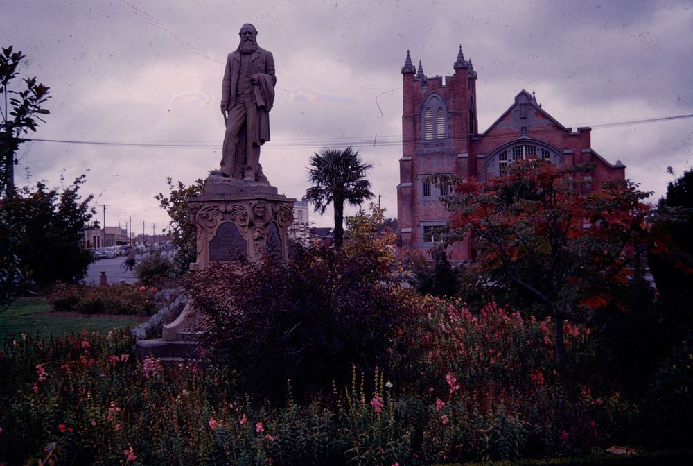 In Ashburton, Statue of John Grigg of Longbeach, and the Methodist church (24 March 1959-13 April1959) by Leslie Adkin.