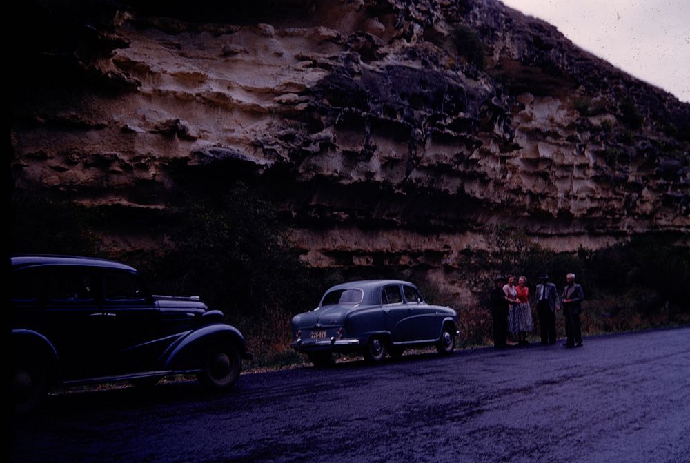 Nearer view of Macrewhenua cliff with rock shelters at base (24 March 1959-13 April 1959) by Leslie Adkin.