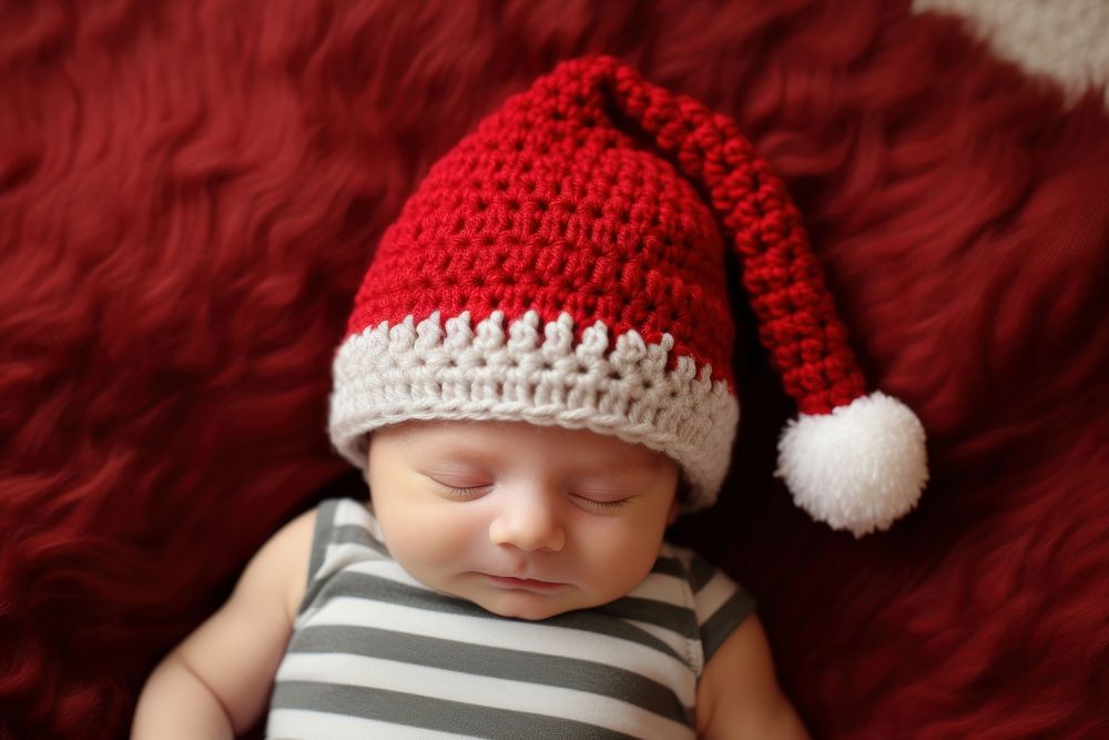 Crocheted Santa hat baby sleeping portrait. AI generated Image by rawpixel.