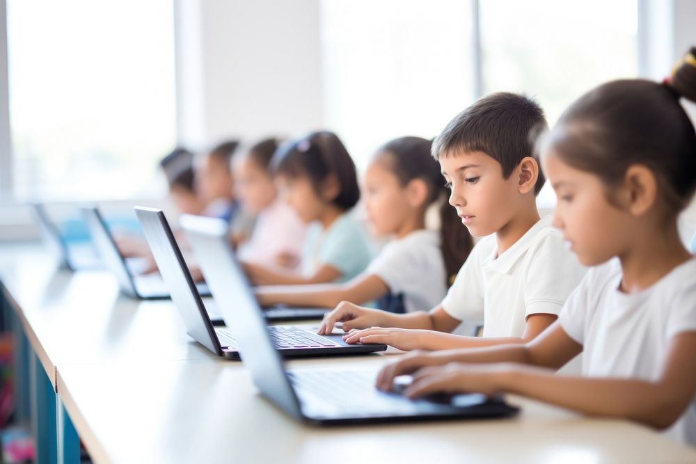 Kids work on Computers computer education classroom. 