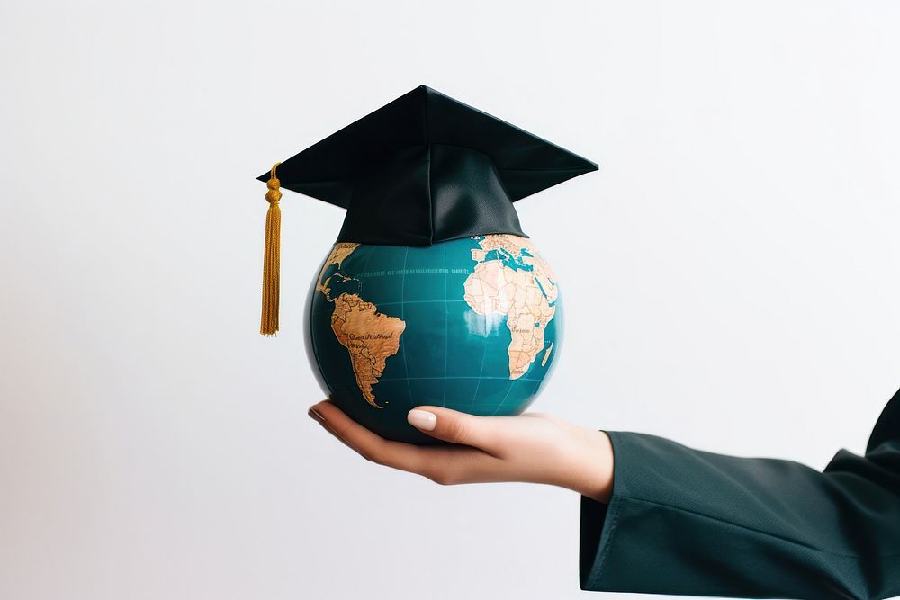 Hand holding earth globe with graduation cap education planet people. AI generated Image by rawpixel.