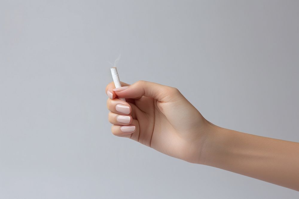 Holding break half of cigarette smoking smoke medication. AI generated Image by rawpixel.