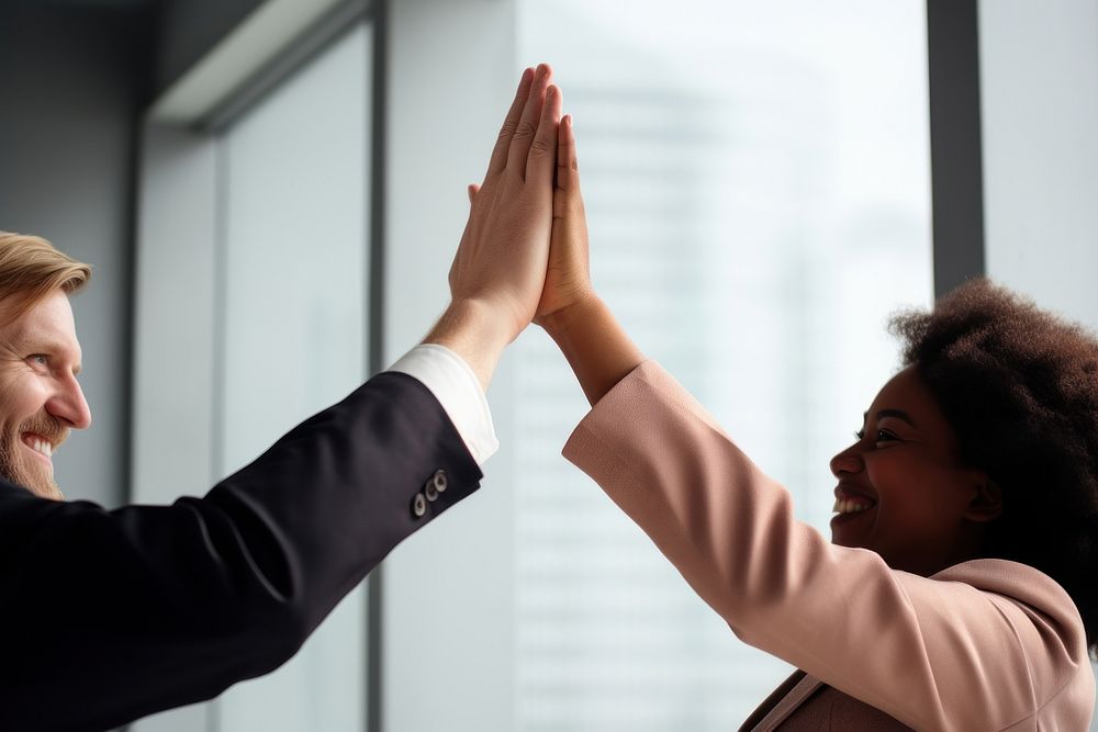 Professionals giving high five office adult togetherness. AI generated Image by rawpixel.