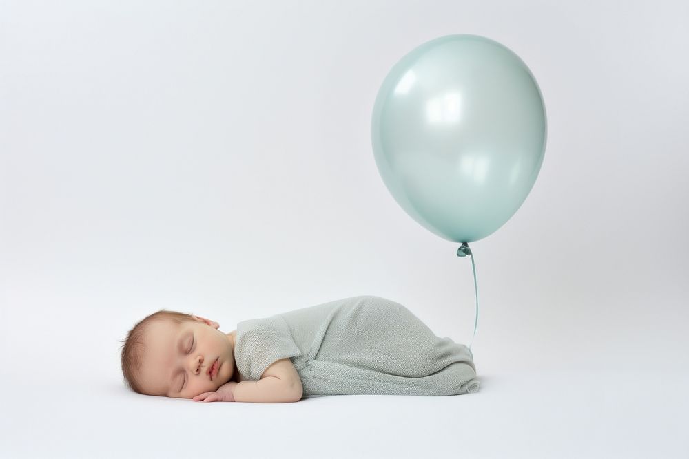 Newborn sleeping balloon portrait baby. AI generated Image by rawpixel.