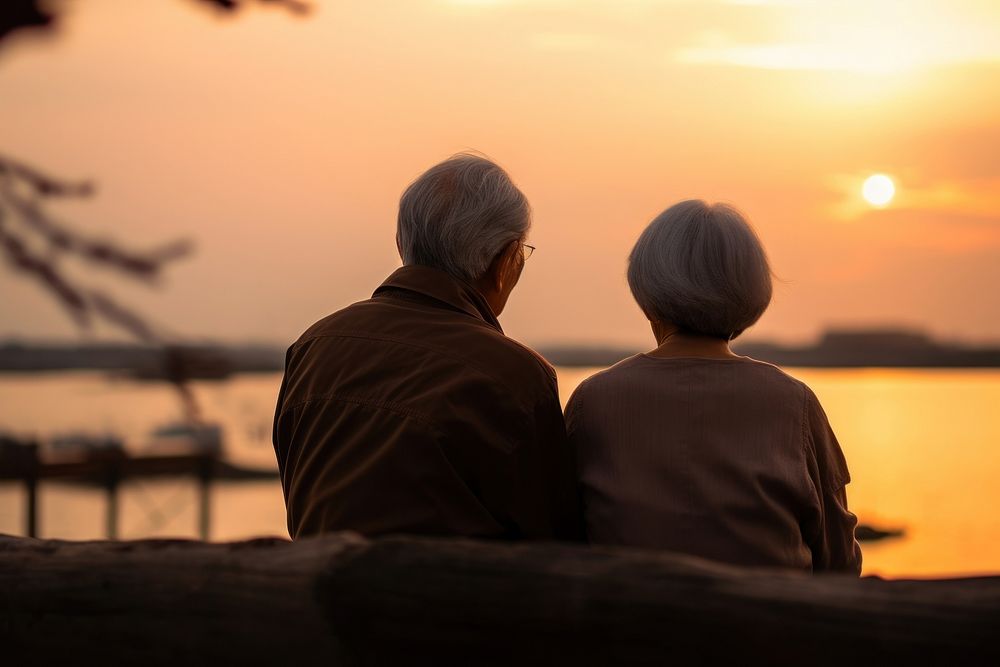 Senior japanese couple photography outdoors sunset. AI generated Image by rawpixel.