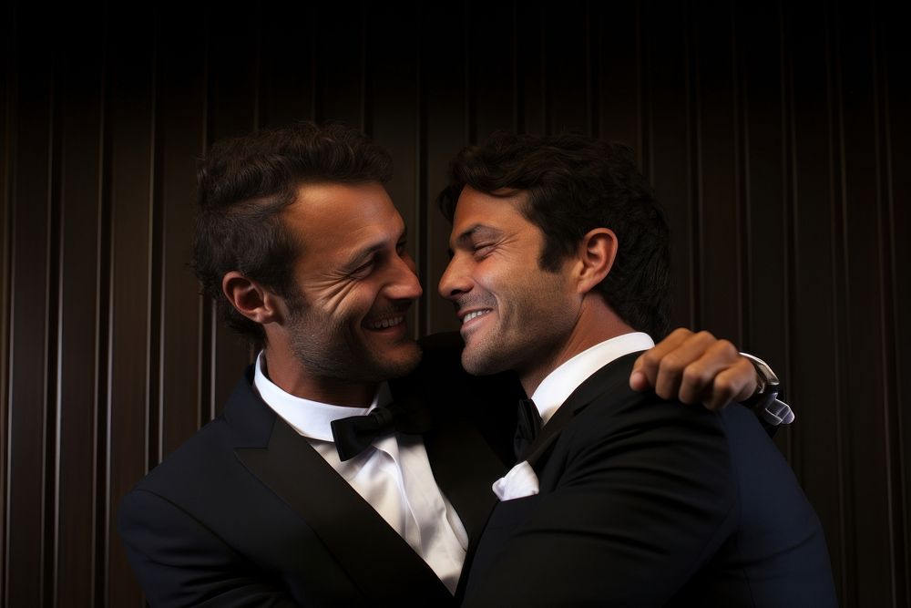 A gay couple at wedding party cheerful portrait tuxedo. AI generated Image by rawpixel.