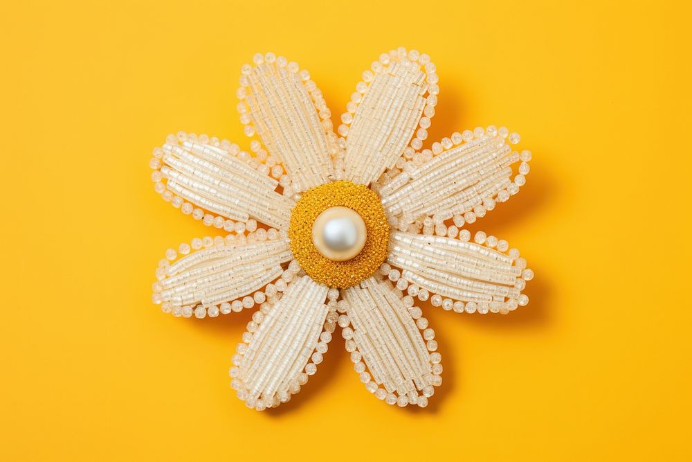 Daisy brooch jewelry yellow. AI generated Image by rawpixel.