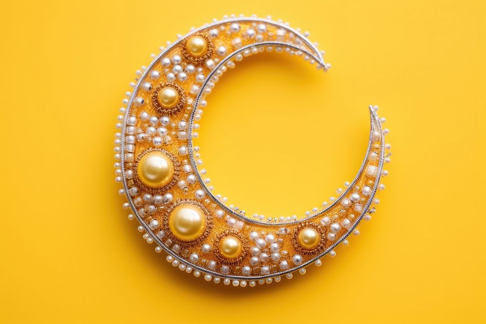 The moon jewelry yellow shape. AI generated Image by rawpixel.