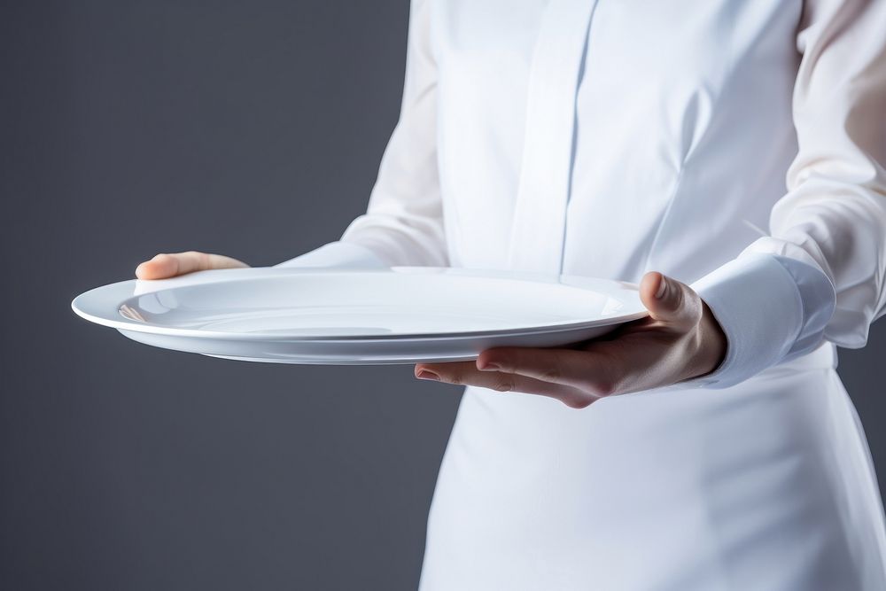 A man waitress hand is holding up a platter adult plate white. AI generated Image by rawpixel.