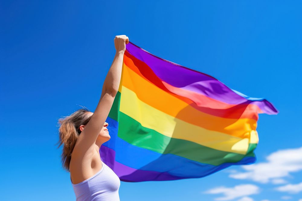 Woman holding a Gay Rainbow Flag flag happiness rainbow. AI generated Image by rawpixel.