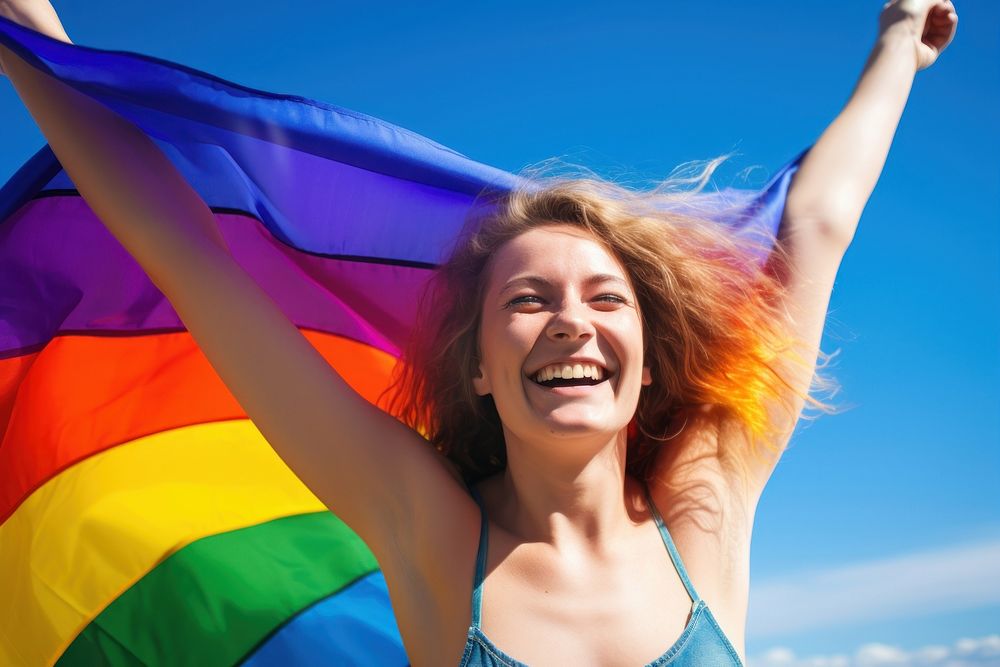 Woman holding a Gay Rainbow Flag happiness rainbow summer. AI generated Image by rawpixel.