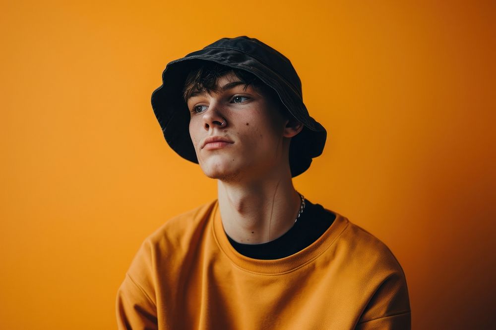 Man wearing a bucket hat photography portrait headshot. 