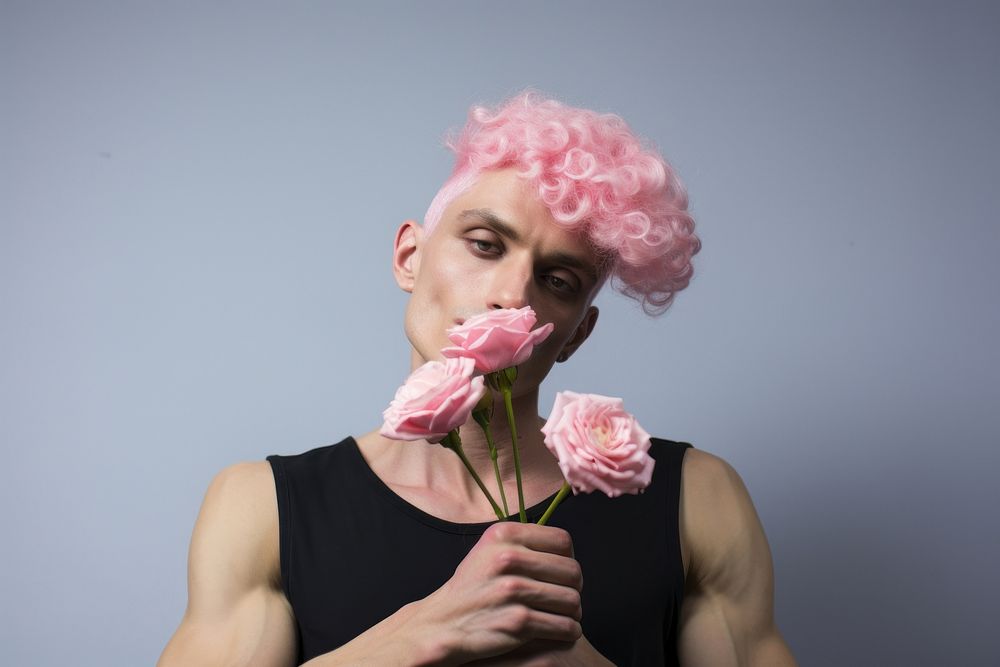 A man with pink hairs flower holding adult. AI generated Image by rawpixel.