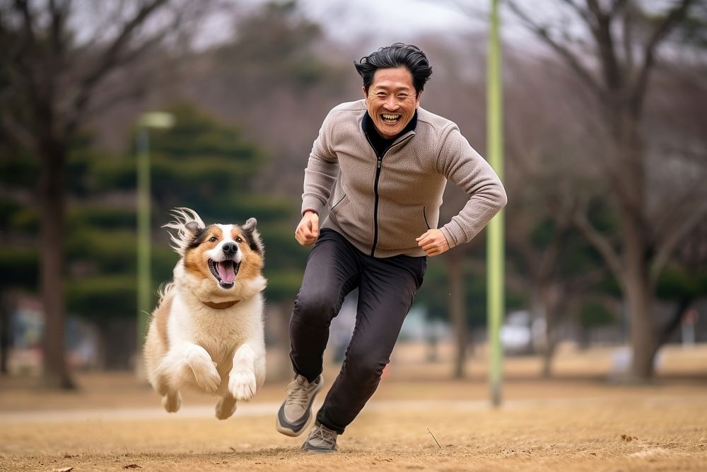Korean man dog running mammal. AI generated Image by rawpixel.