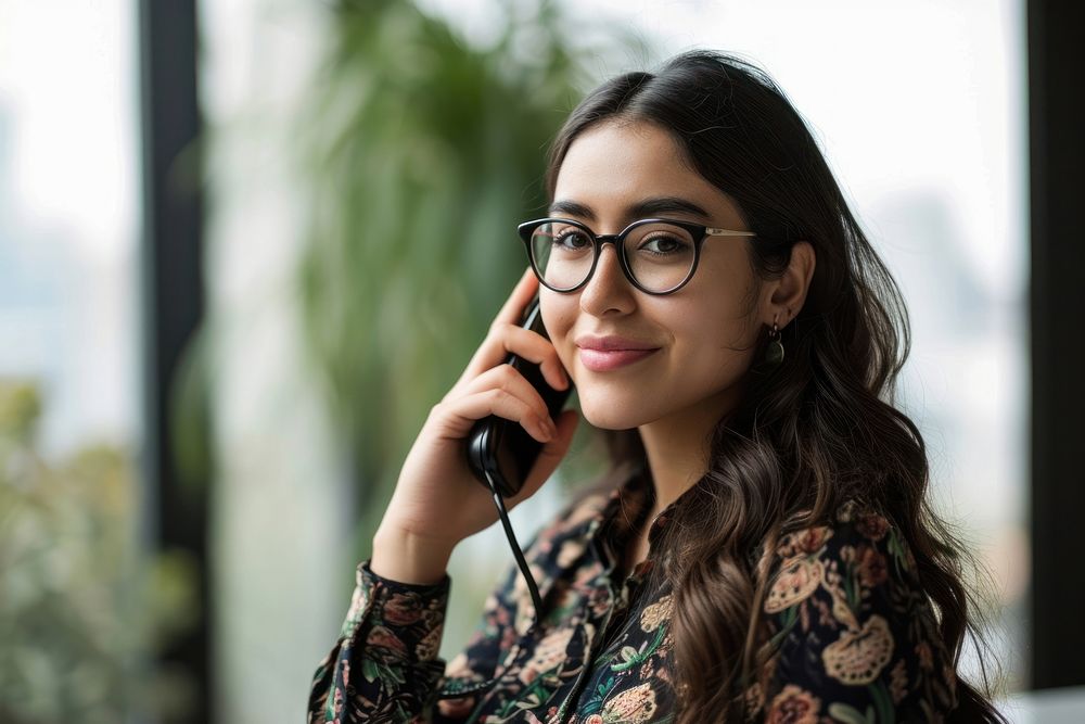 Mexican woman talking on phone glasses adult photo. AI generated Image by rawpixel.