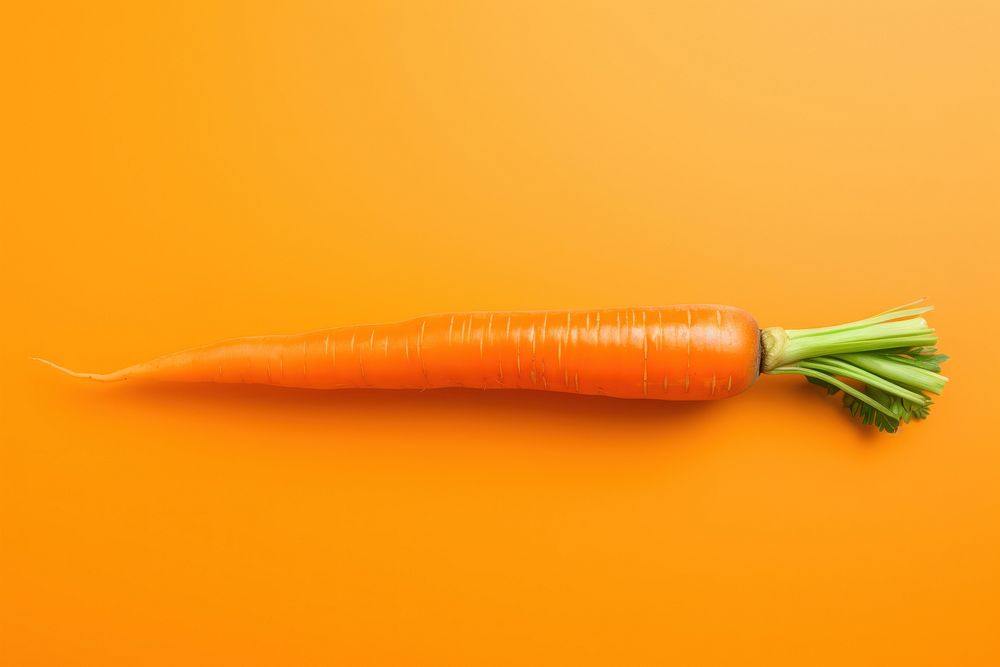 A carrot vegetable food orange background. AI generated Image by rawpixel.