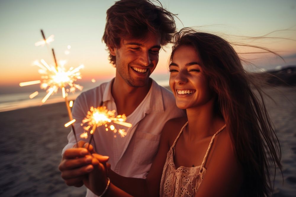 Man and girl celebrate holding sparkler sunset sparks beach. AI generated Image by rawpixel.