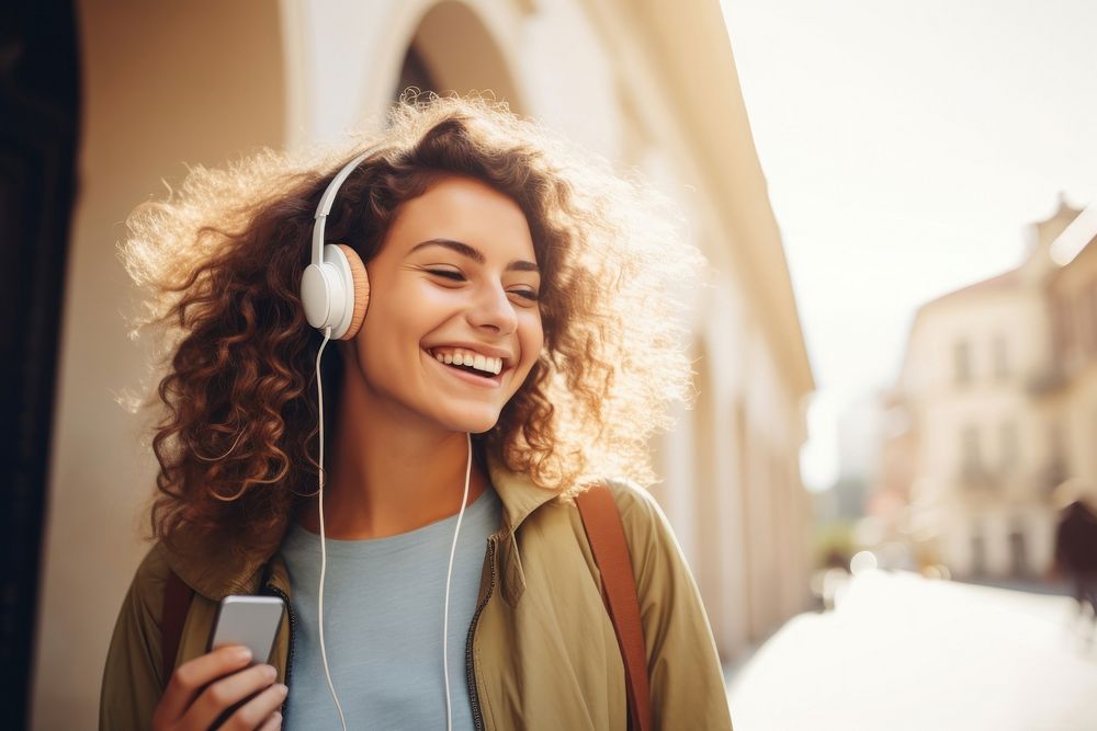 Happy young woman headphones listening laughing. AI generated Image by rawpixel.