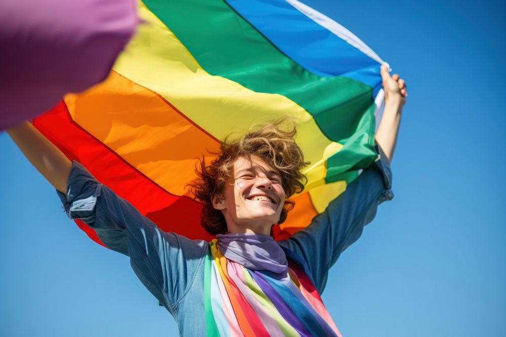 Man holding a Gay Rainbow Flag happiness rainbow pride. AI generated Image by rawpixel.