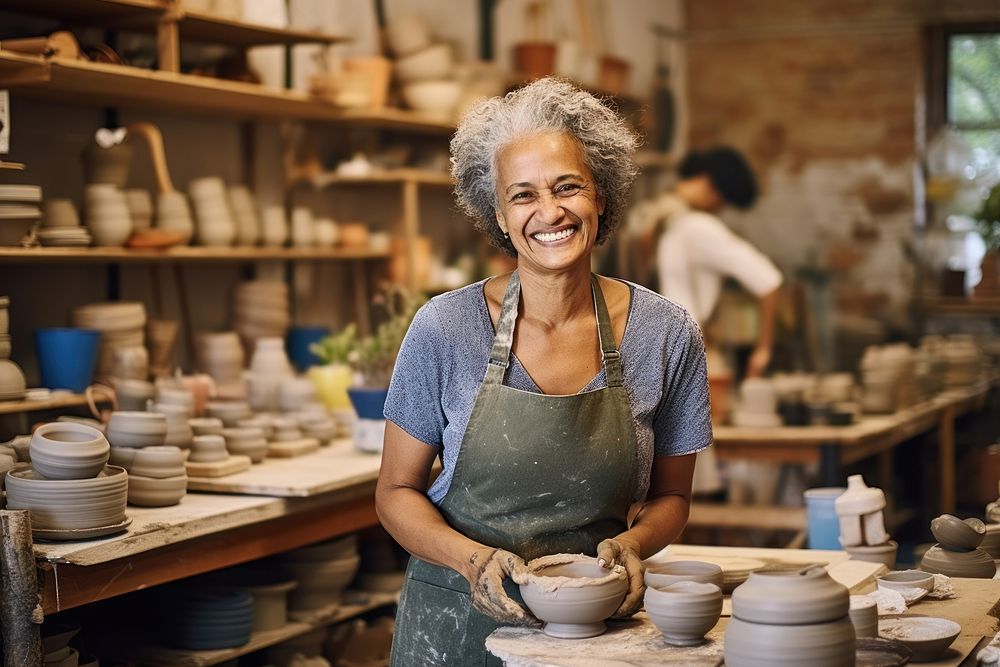 Mixed race pottery ceramic smiling. AI generated Image by rawpixel.