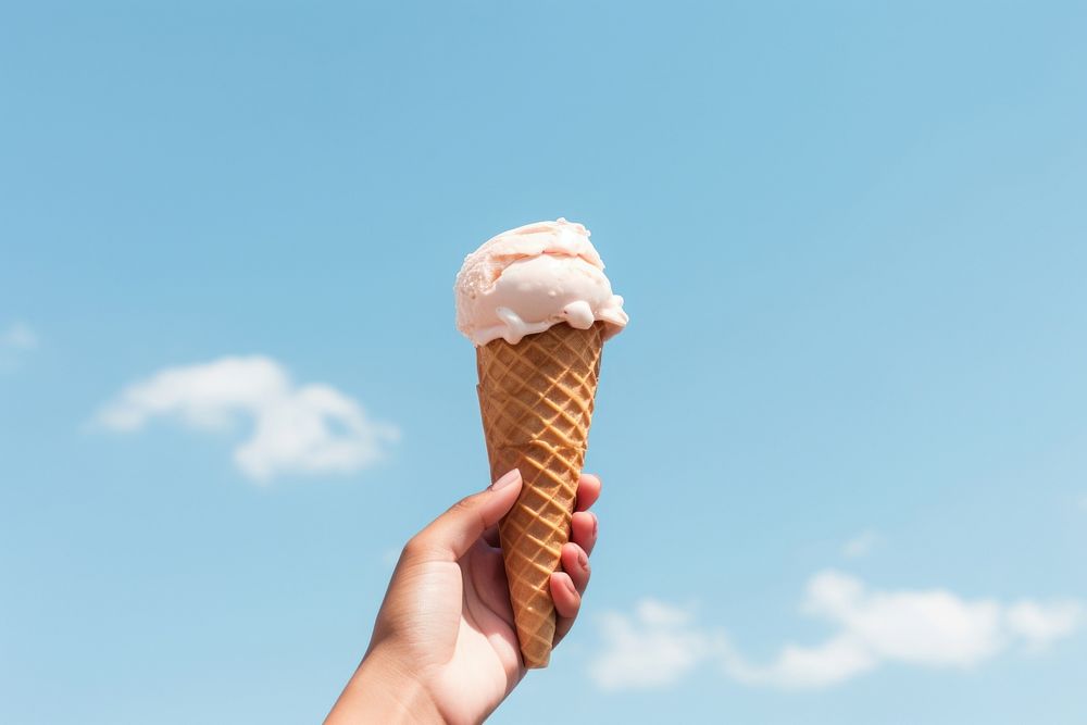 A hand holding a melting earth ice-cream dessert summer food. AI generated Image by rawpixel.
