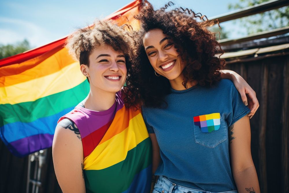 Smiling Lesbian couple standing smiling pride. AI generated Image by rawpixel.