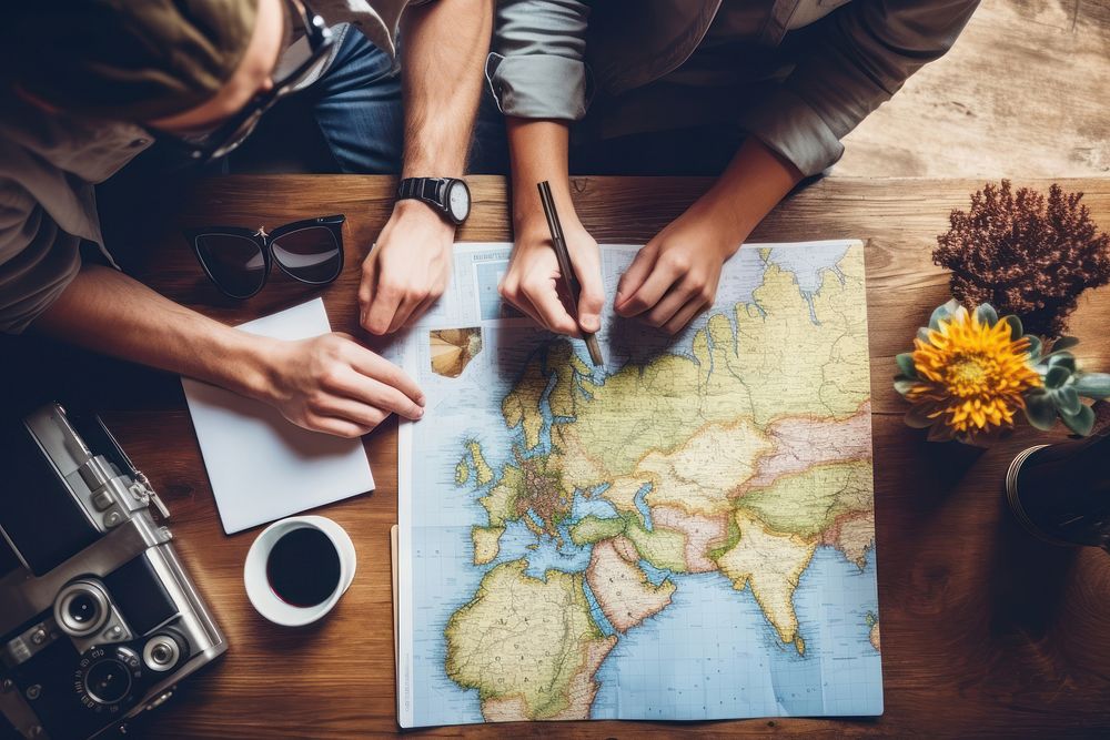 Planning vacation trip table map adult. AI generated Image by rawpixel.