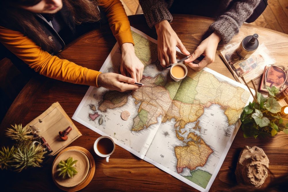 Planning vacation trip table map coffee. AI generated Image by rawpixel.