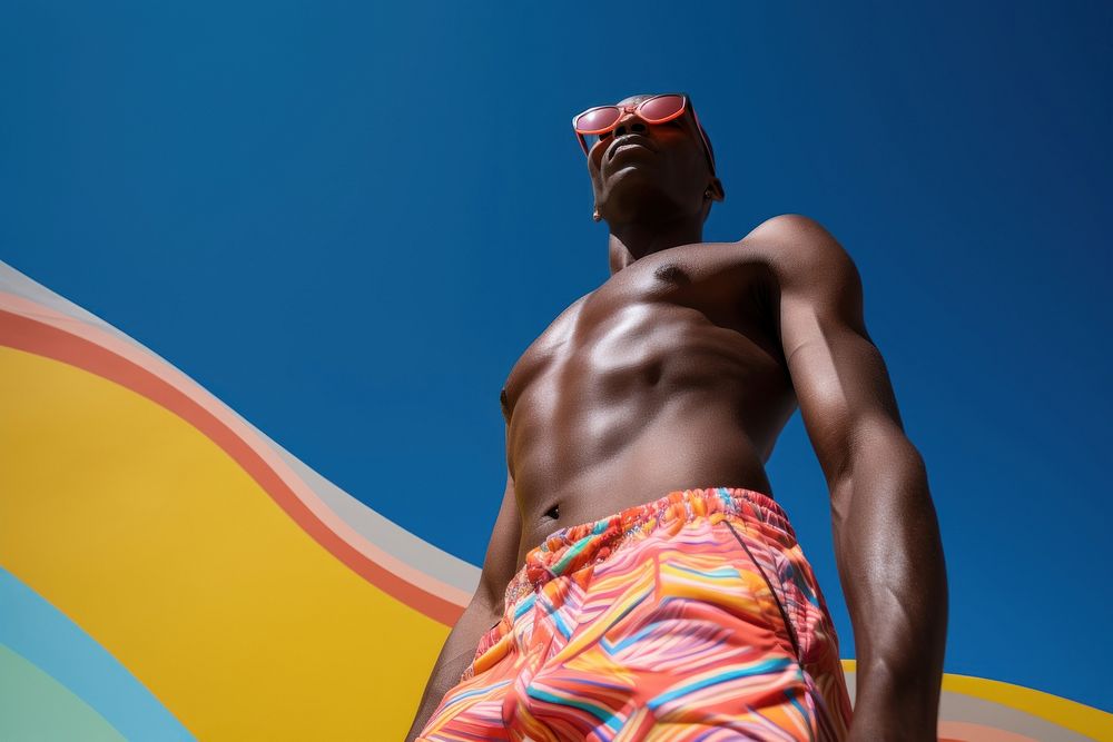 Man wearing swimming shorts sunbathing fashion adult. AI generated Image by rawpixel.