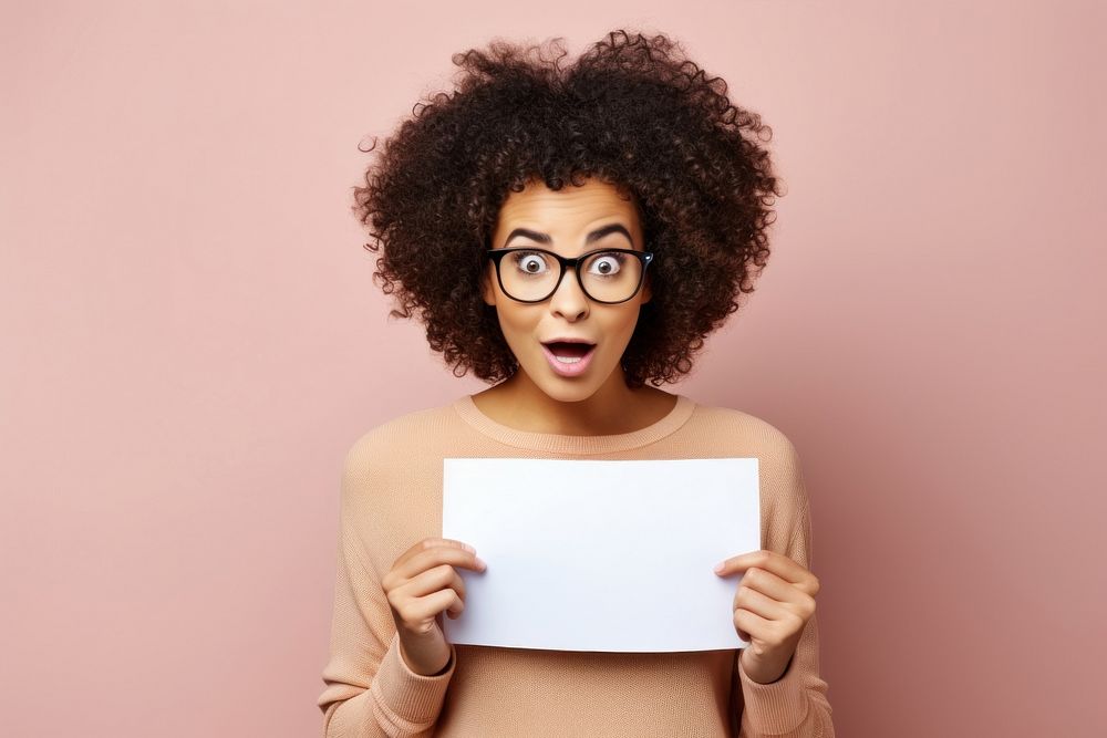 Young woman holding empty speech bubble paper surprised glasses adult. AI generated Image by rawpixel.