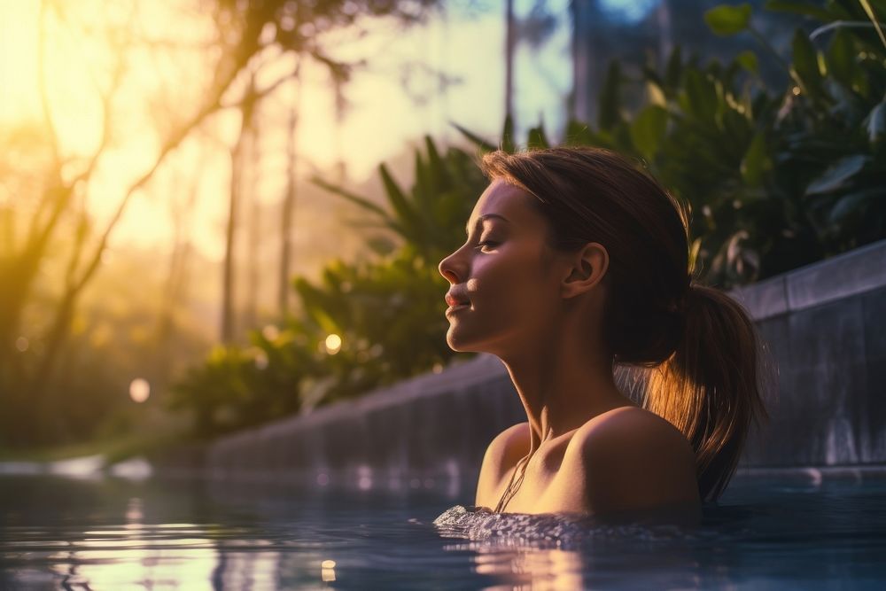 Young woman relaxing doing spa swimming outdoors recreation. AI generated Image by rawpixel.