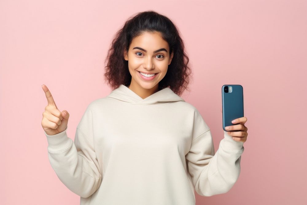 Young woman showing a black screen displaying sweatshirt sweater selfie. AI generated Image by rawpixel.