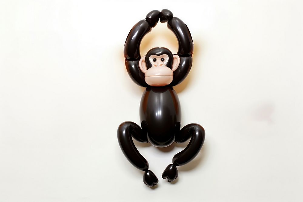 A balloon twisting in the shape of a monkey toy representation figurine. AI generated Image by rawpixel.