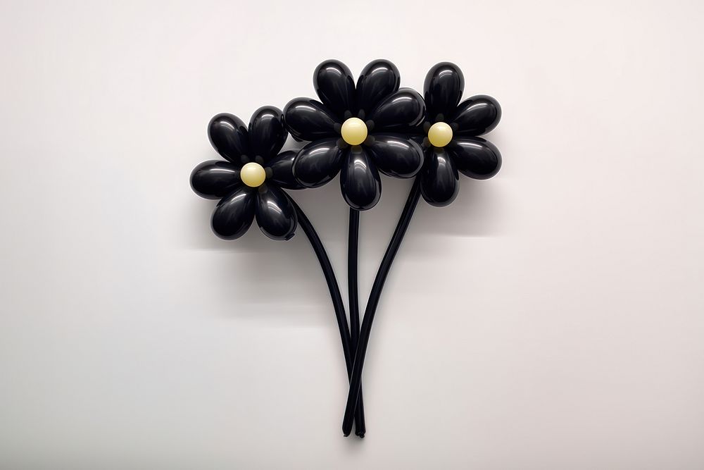Balloon twisting in the shape of flowers brooch black white. AI generated Image by rawpixel.