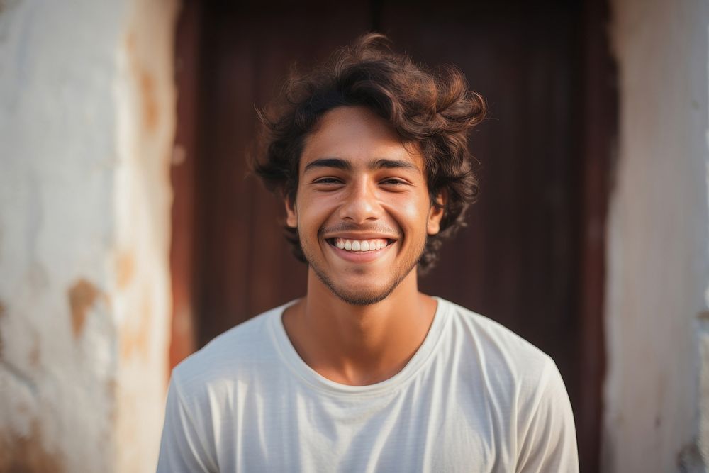 Young indian man laughing portrait smiling. AI generated Image by rawpixel.