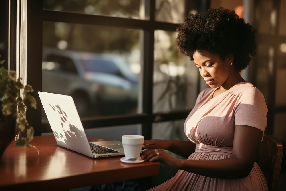 African American woman pregnant computer sitting working. AI generated Image by rawpixel.