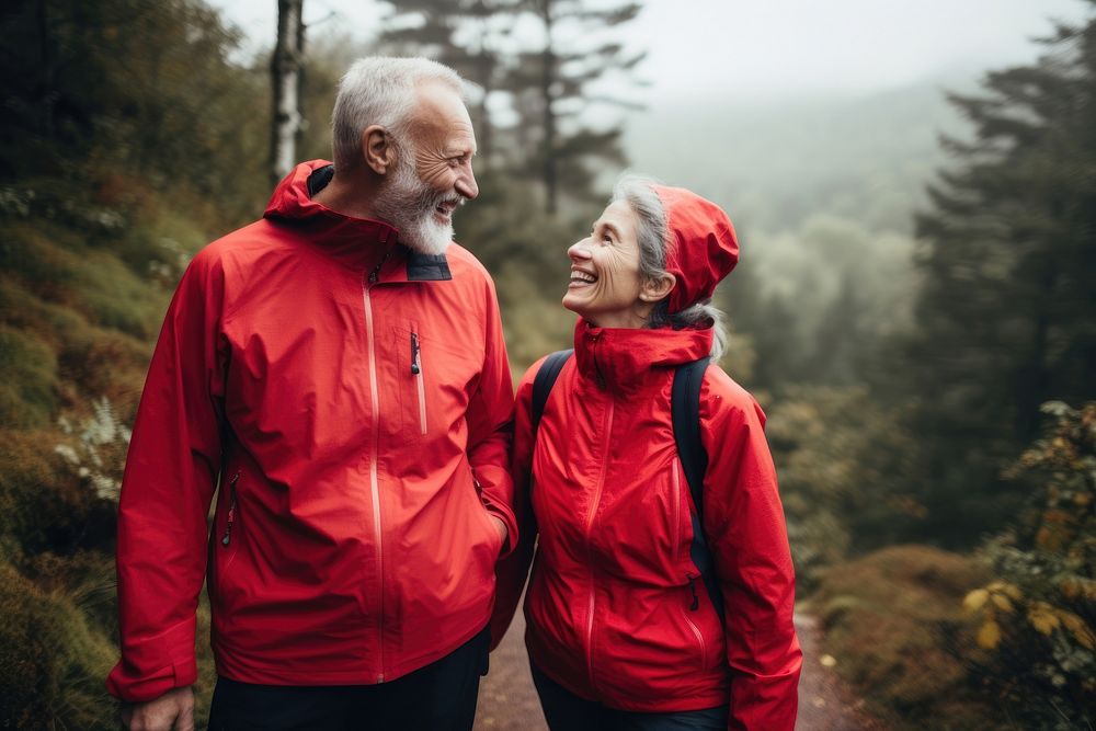 Elderly couple hiking raincoat looking sports. AI generated Image by rawpixel.