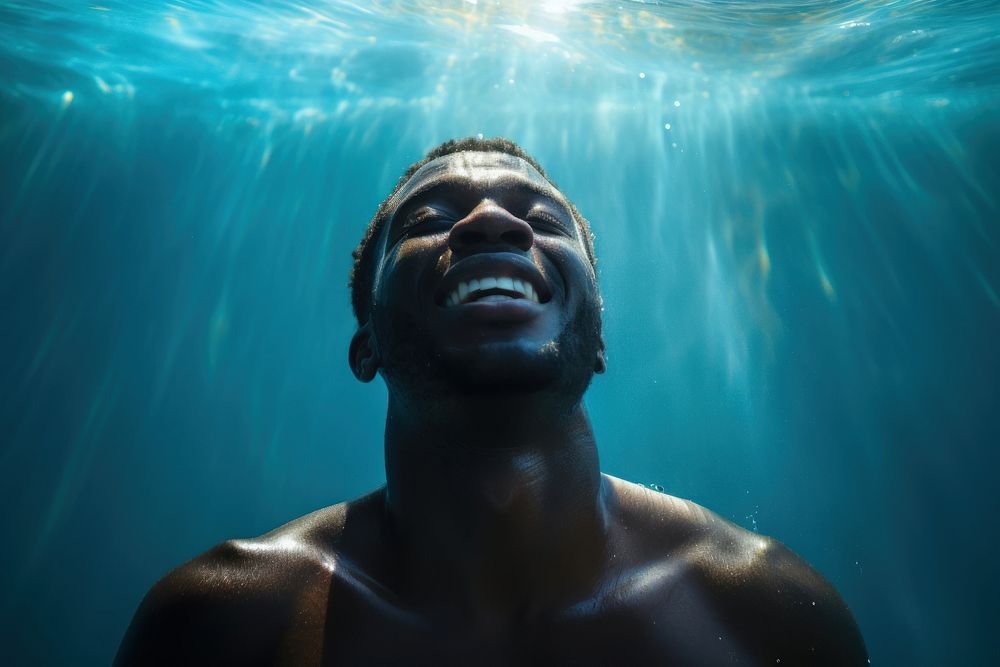 Black man swimming photography underwater. AI generated Image by rawpixel.