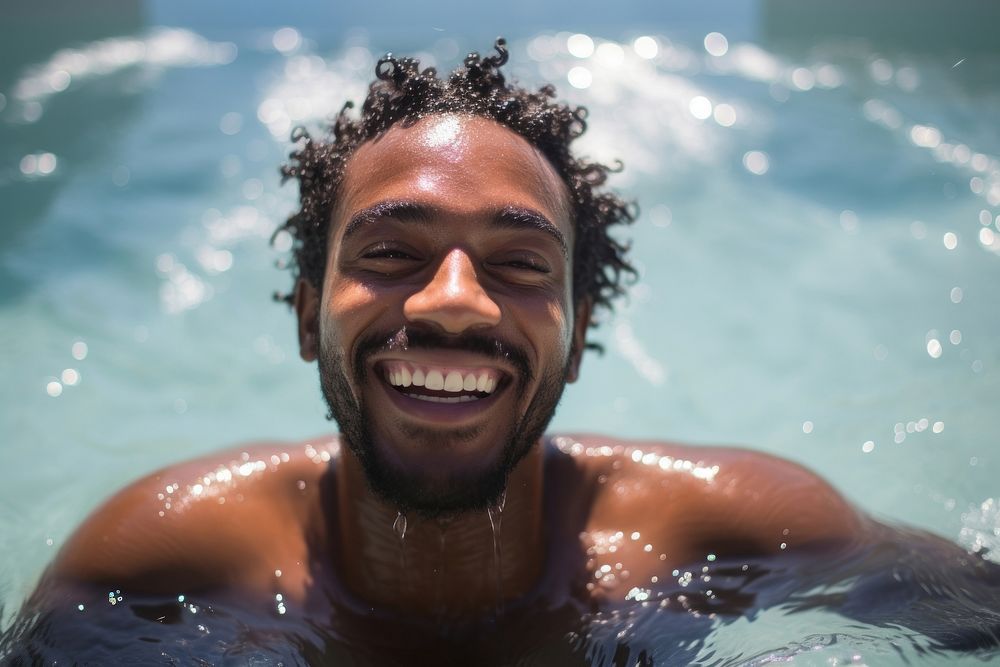 Black man swimming laughing bathing. AI generated Image by rawpixel.
