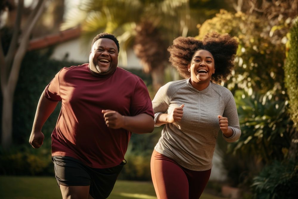 Chubby african-american couple jogging laughing running sports. AI generated Image by rawpixel.