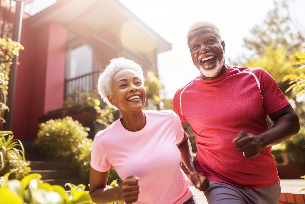Elderly African couple jogging laughing sports adult. AI generated Image by rawpixel.