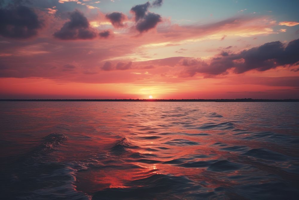 Sunset over water outdoors horizon nature. AI generated Image by rawpixel.