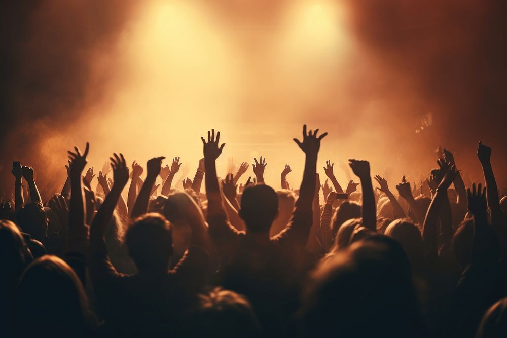 Raising hands concert atmosphere crowd. AI generated Image by rawpixel.